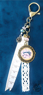Vintage Sewing Purse Charm – Resin Cabochon with Antique Sewing Machine, Lace & Measuring Tape Ribbon