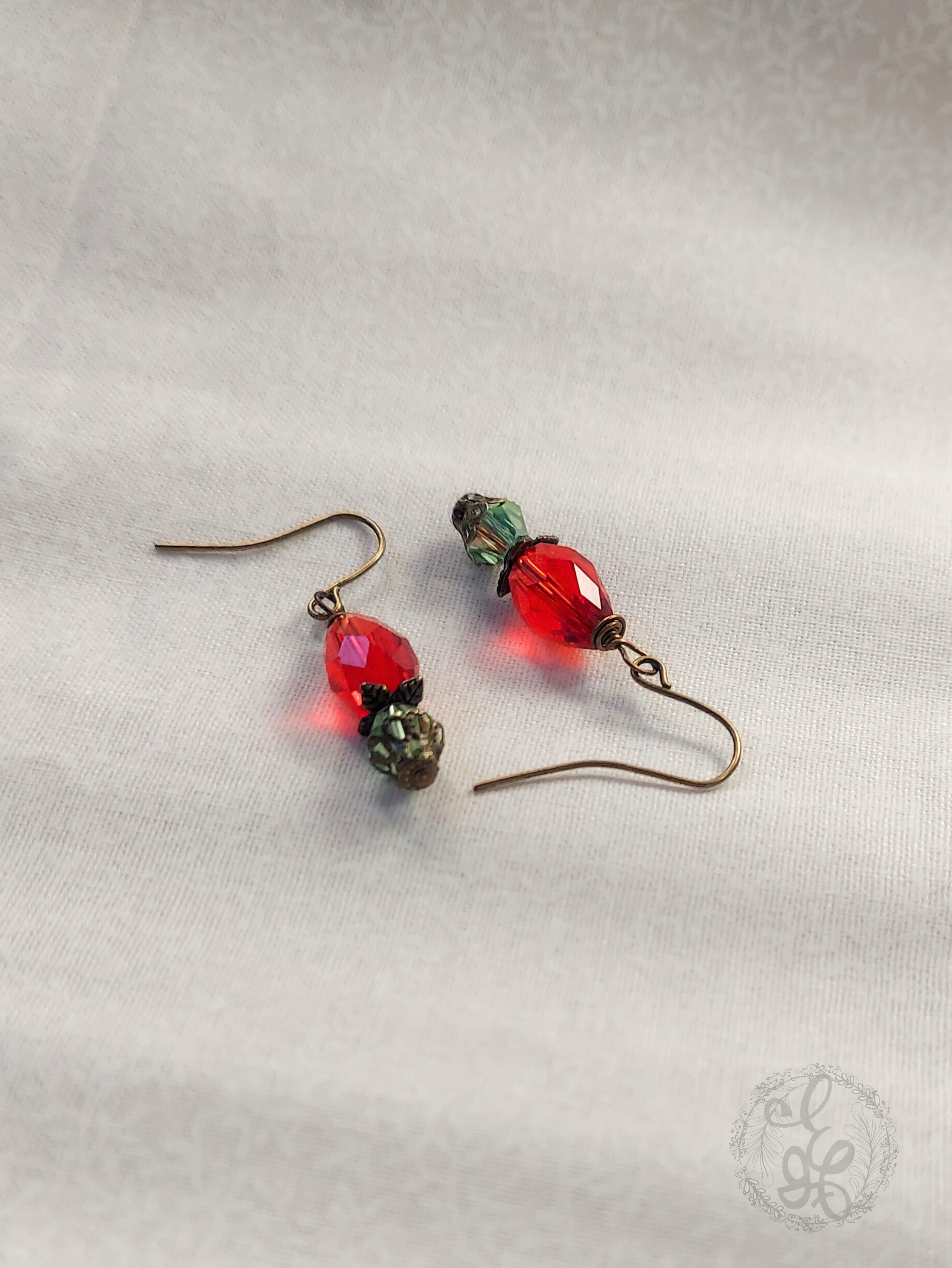 Red Rosebud Crystal Dangle Earrings in Antique Brass