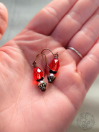 Red Rosebud Crystal Dangle Earrings in Antique Brass