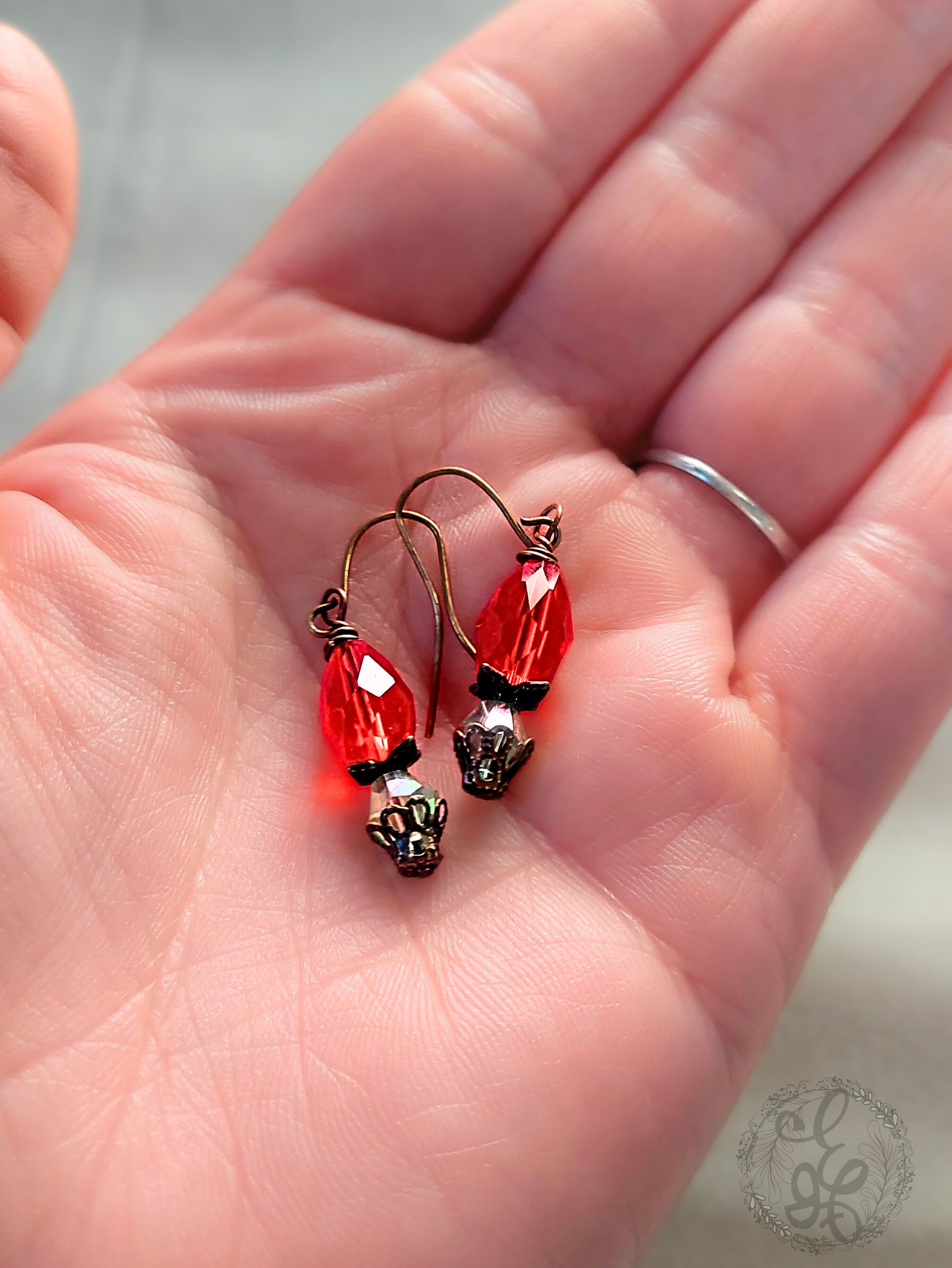 Red Rosebud Crystal Dangle Earrings in Antique Brass