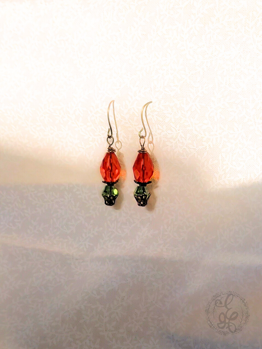 Red Rosebud Crystal Dangle Earrings in Antique Brass