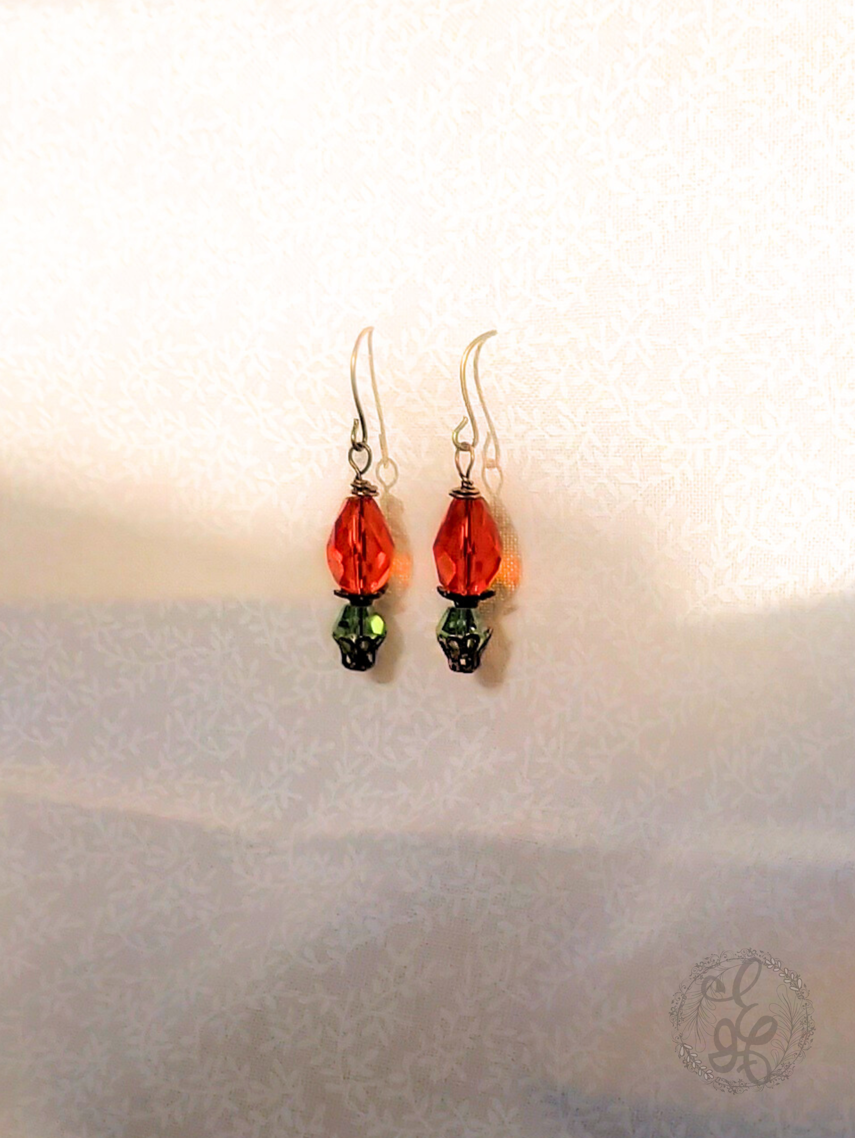 Red Rosebud Crystal Dangle Earrings in Antique Brass